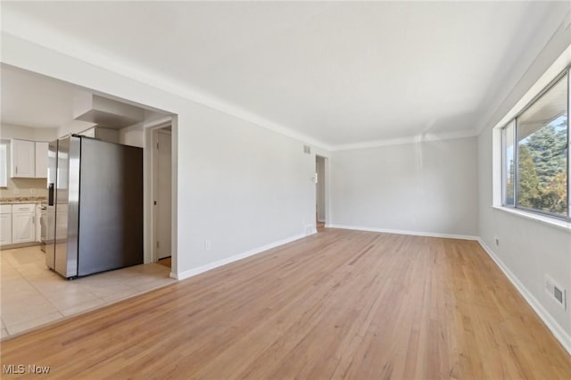 6372 Tanglewood Ln, Seven Hills, OH 44131 - unfurnished living room featuring light wood-style floors and baseboards