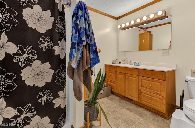bathroom featuring vanity, crown molding, toilet, a textured ceiling, and curtained shower