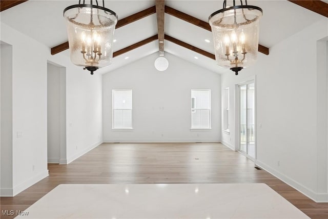 8933 Camden Rd NW, Massillon, OH 44646 - unfurnished dining area with a chandelier and wood finished floors
