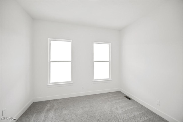 8933 Camden Rd NW, Massillon, OH 44646 - carpeted spare room featuring baseboards