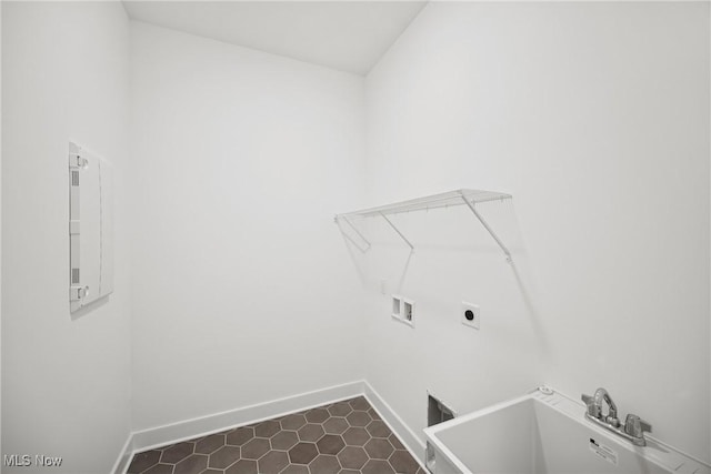 8933 Camden Rd NW, Massillon, OH 44646 - washroom featuring hookup for a washing machine, dark tile patterned flooring, and electric dryer hookup