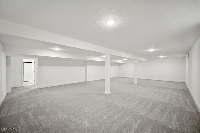 8933 Camden Rd NW, Massillon, OH 44646 - finished below grade area with carpet flooring and a textured ceiling