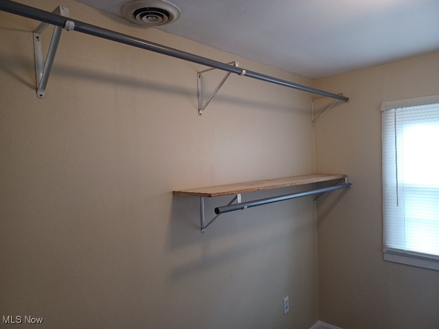 walk in closet featuring visible vents