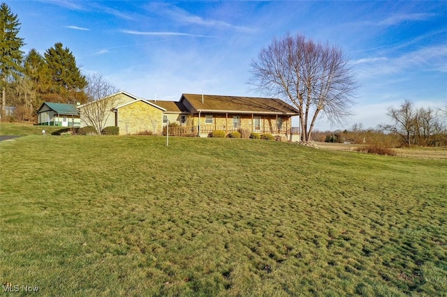 ranch-style home with a front lawn