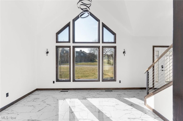 3189 Chardonnay Ln, Poland, OH 44514 - interior space with high vaulted ceiling, marble finish floor, baseboards, and stairway