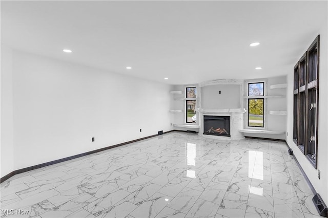 3189 Chardonnay Ln, Poland, OH 44514 - unfurnished living room with baseboards, recessed lighting, and marble finish floor