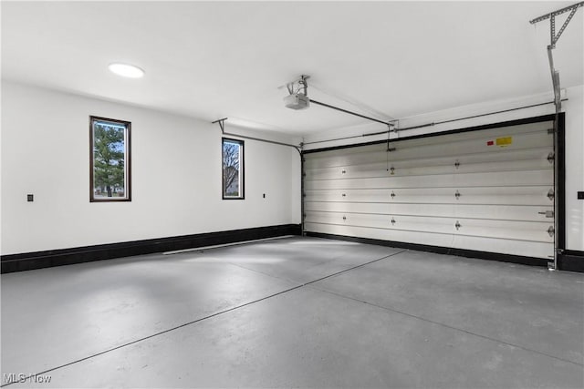 3189 Chardonnay Ln, Poland, OH 44514 - garage with a garage door opener and baseboards