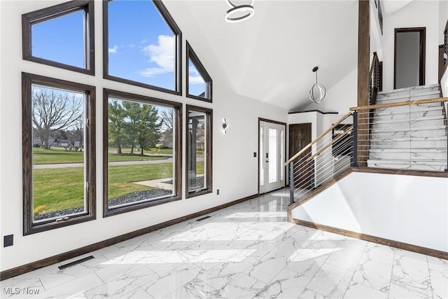 3189 Chardonnay Ln, Poland, OH 44514 - entrance foyer with high vaulted ceiling, visible vents, marble finish floor, stairs, and baseboards