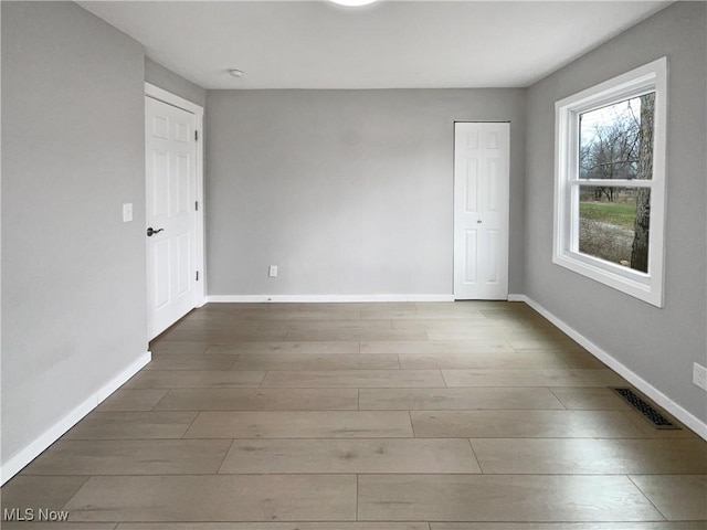 8414 York Rd, North Royalton, OH 44133 - unfurnished room with wood finished floors, visible vents, and baseboards
