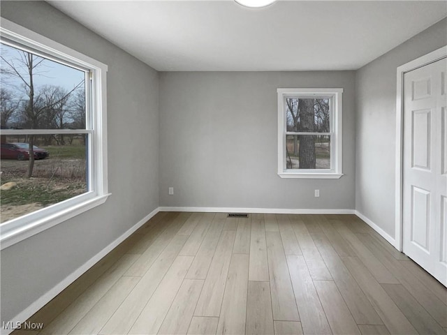 8414 York Rd, North Royalton, OH 44133 - empty room featuring baseboards, wood finished floors, and visible vents