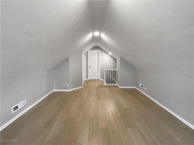 8414 York Rd, North Royalton, OH 44133 - additional living space with baseboards, visible vents, and a textured ceiling