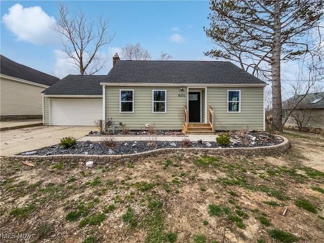 8414 York Rd, North Royalton, OH 44133 - view of front facade with an attached garage, driveway, and a chimney
