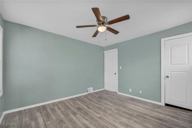 11504 E Blvd, Cleveland, OH 44105 - unfurnished bedroom featuring visible vents, baseboards, wood finished floors, and ceiling fan