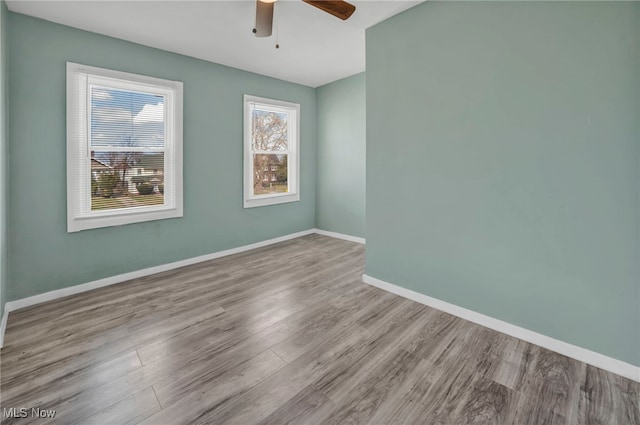 11504 E Blvd, Cleveland, OH 44105 - empty room featuring baseboards, a ceiling fan, and wood finished floors