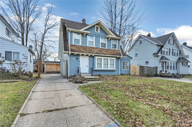 11504 E Blvd, Cleveland, OH 44105 - view of front of house featuring a front yard, fence, and a shingled roof