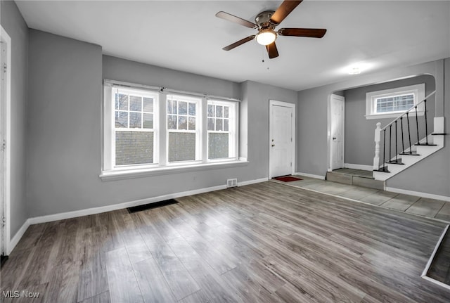 11504 E Blvd, Cleveland, OH 44105 - entryway featuring baseboards, stairway, wood finished floors, and a ceiling fan