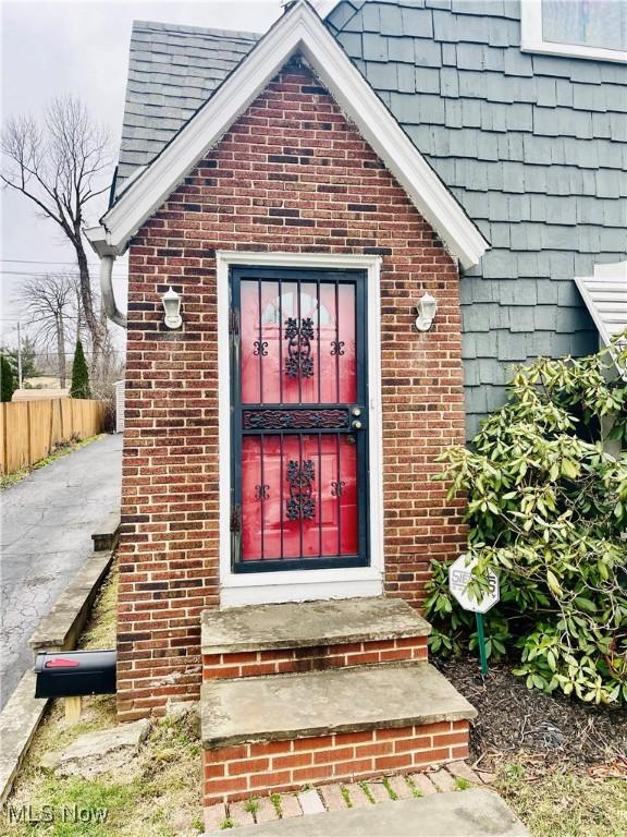 1655 Ivydale Rd, Cleveland Heights, OH 44118 - entrance to property with brick siding and fence