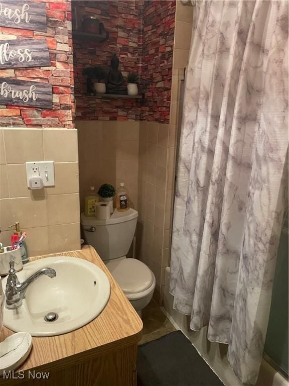 1655 Ivydale Rd, Cleveland Heights, OH 44118 - full bathroom featuring tile walls, toilet, tile patterned flooring, and vanity