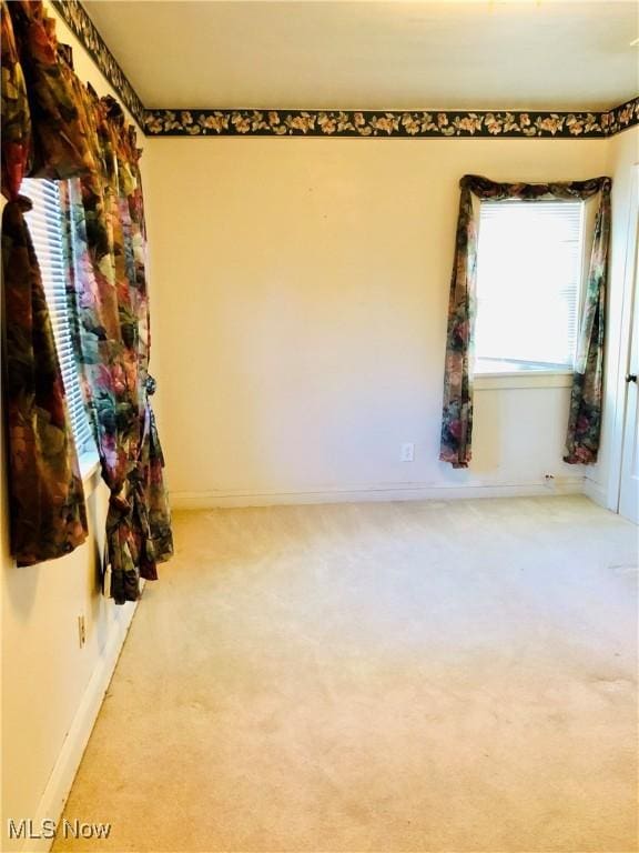 1655 Ivydale Rd, Cleveland Heights, OH 44118 - empty room with baseboards and carpet floors