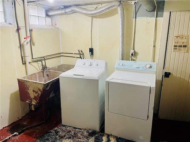 1655 Ivydale Rd, Cleveland Heights, OH 44118 - laundry room featuring washing machine and clothes dryer, a sink, and laundry area