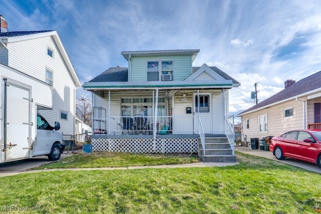 7115 Laverne Ave, Parma, OH 44129 - bungalow-style house featuring covered porch and a front lawn