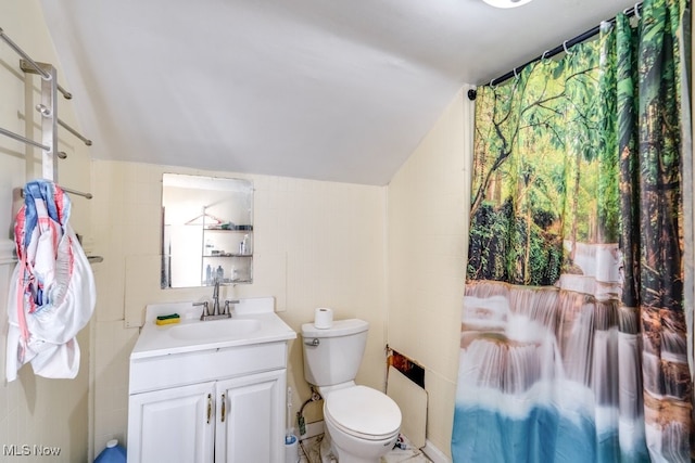7115 Laverne Ave, Parma, OH 44129 - bathroom with tile walls, lofted ceiling, toilet, and vanity