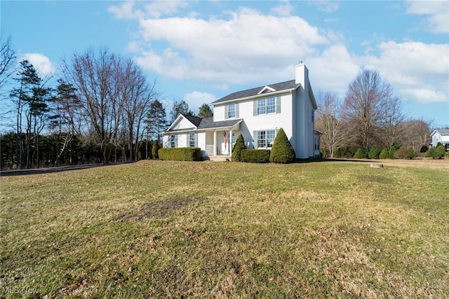 view of front of property featuring a chimney and a front lawn