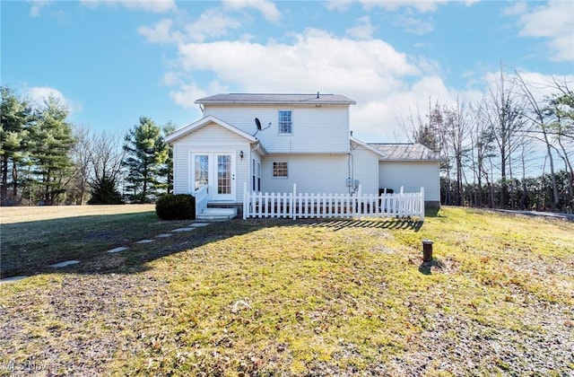 exterior space featuring a front lawn and entry steps