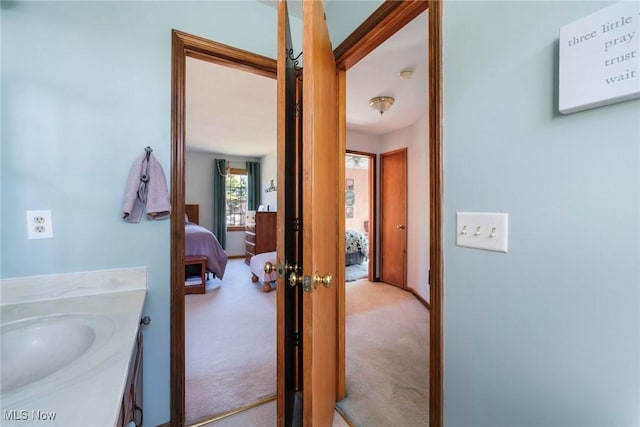 ensuite bathroom featuring vanity and ensuite bathroom
