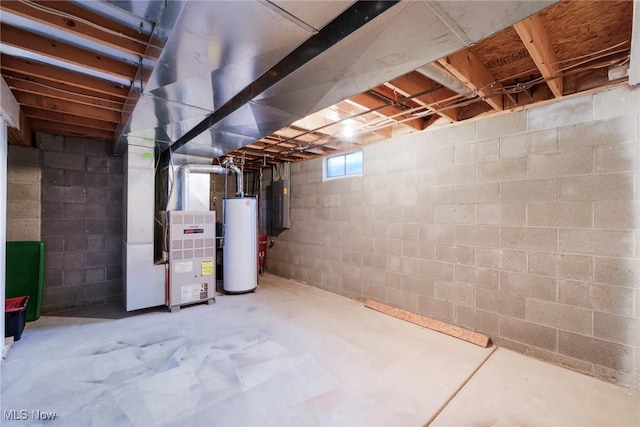 basement featuring heating unit, gas water heater, and electric panel