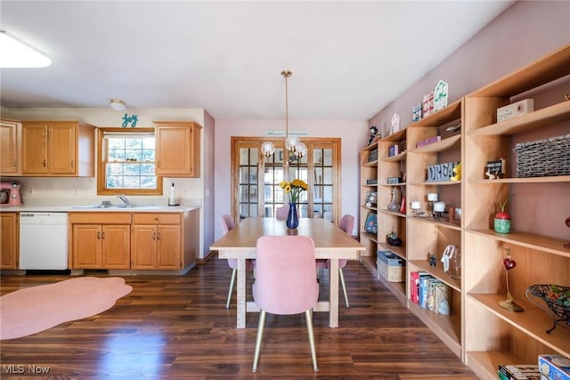 dining room featuring a notable chandelier and dark wood-style floors
