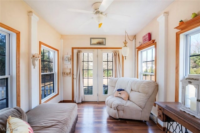 sitting room featuring dark wood-style flooring and a ceiling fan