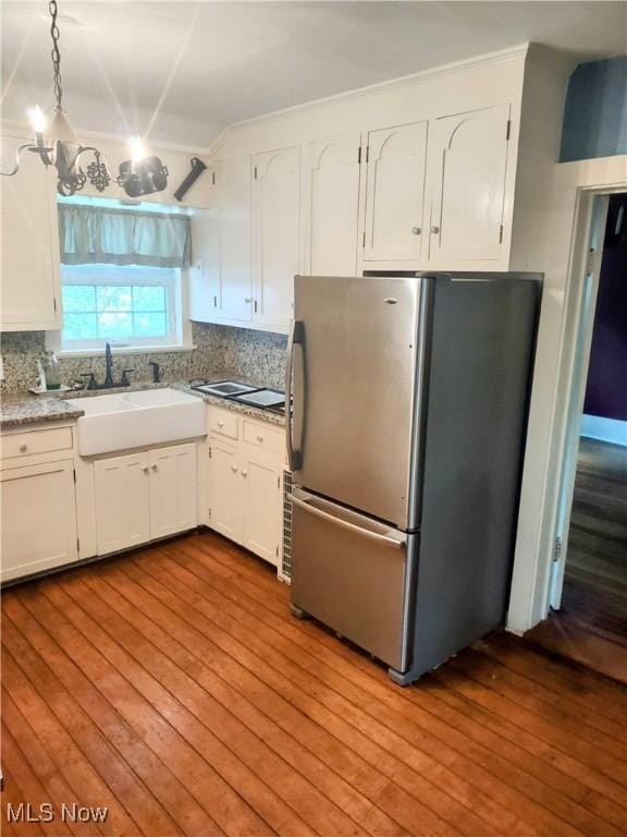 6846 Wakefield, Hiram, OH 44234 - kitchen with freestanding refrigerator, hardwood / wood-style flooring, tasteful backsplash, and white cabinets