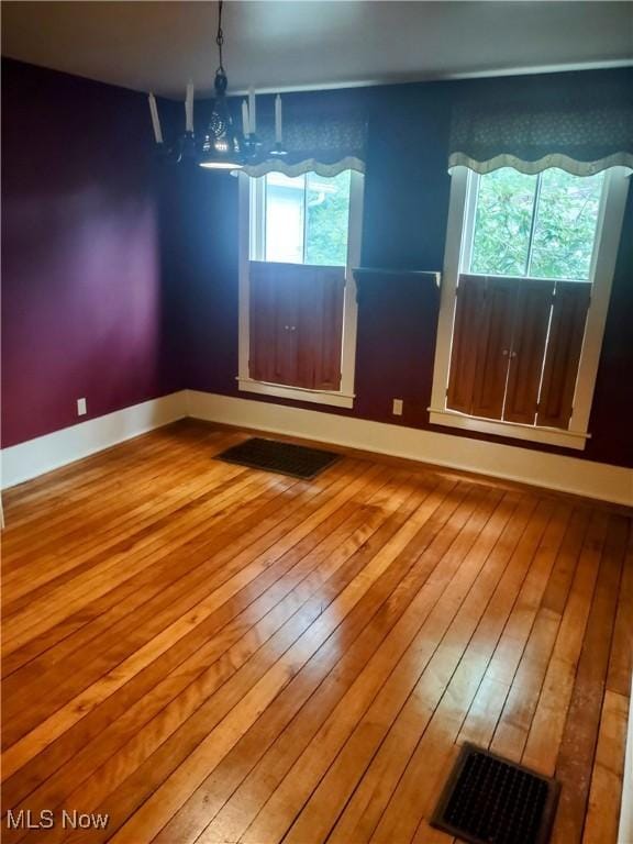 6846 Wakefield, Hiram, OH 44234 - empty room featuring hardwood / wood-style flooring, plenty of natural light, and baseboards
