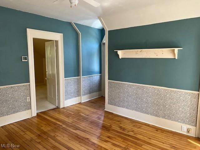 6846 Wakefield, Hiram, OH 44234 - unfurnished room with hardwood / wood-style floors, a ceiling fan, vaulted ceiling, and baseboards