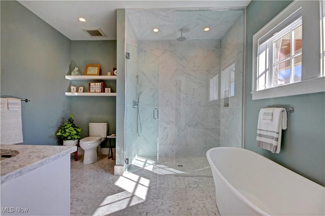 full bath with visible vents, a marble finish shower, toilet, recessed lighting, and a freestanding bath