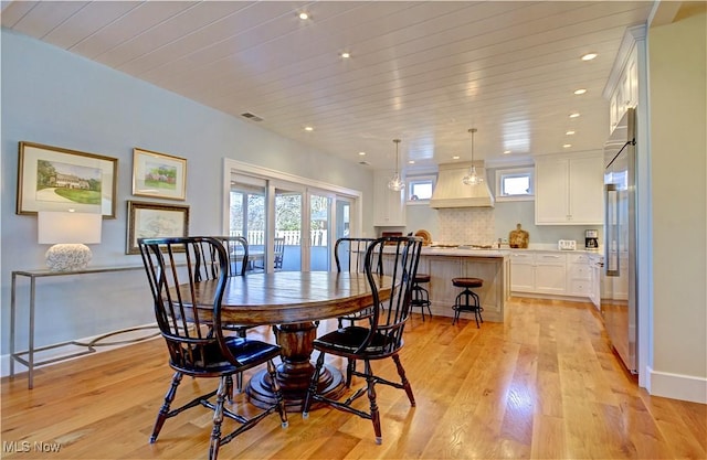 dining space featuring recessed lighting, visible vents, light wood-style floors, and wooden ceiling