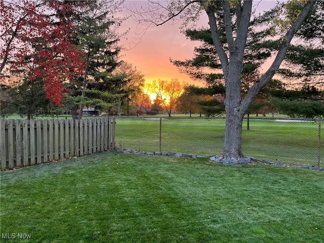 yard at dusk with fence