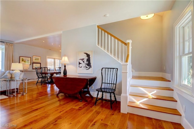 stairs featuring baseboards and wood finished floors