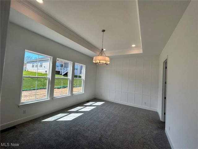 8929 Camden Rd NW, Massillon, OH 44646 - spare room with a raised ceiling, dark carpet, healthy amount of natural light, baseboards, and recessed lighting