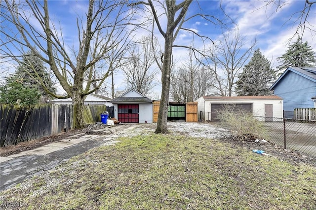 3716 E 52nd St, Cleveland, OH 44105 - view of yard featuring a detached garage, an outdoor structure, and fence private yard