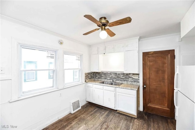 3716 E 52nd St, Cleveland, OH 44105 - kitchen featuring dark wood-style floors, visible vents, a ceiling fan, and freestanding refrigerator