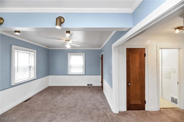 3716 E 52nd St, Cleveland, OH 44105 - spare room with visible vents, carpet floors, ornamental molding, and a ceiling fan