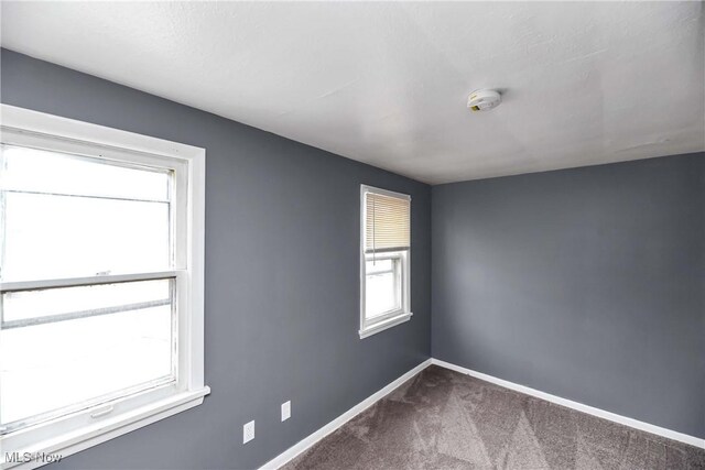 3716 E 52nd St, Cleveland, OH 44105 - carpeted empty room featuring baseboards