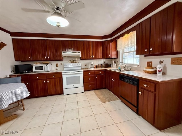kitchen featuring light countertops, white appliances, under cabinet range hood, a sink, and a ceiling fan