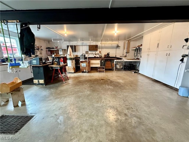 garage with a workshop area
