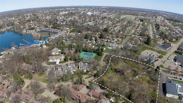 drone / aerial view with a residential view and a water view
