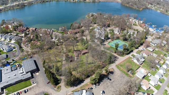 drone / aerial view with a residential view and a water view