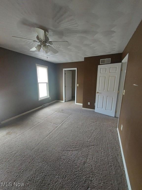 87478 Sinfield Rd, Hopedale, OH 43976 - interior space featuring baseboards, carpet floors, ceiling fan, and visible vents