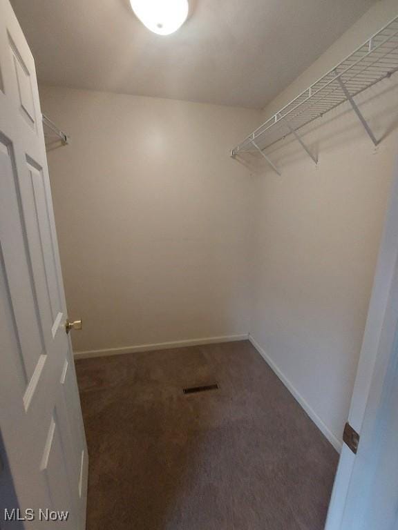 87478 Sinfield Rd, Hopedale, OH 43976 - walk in closet featuring visible vents and dark carpet